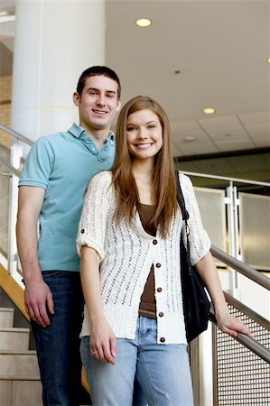 smart poses of teenager girl - Two college student chatting on steps after classs. Stock Photo - Budget Royalty-Free & Subscription, Code: 400-04596308