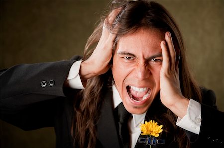 simsearch:400-04172755,k - Handsome man screaming in formal jacket with boutonniere Stock Photo - Budget Royalty-Free & Subscription, Code: 400-04596347