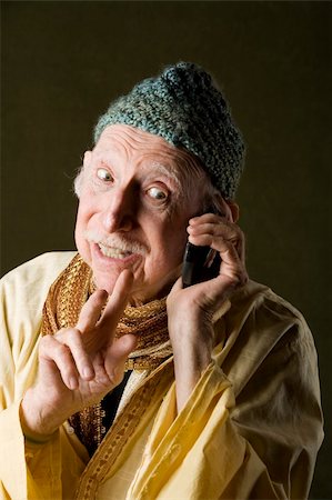 simsearch:400-04596625,k - Wise Man with Knit Cap Talking on Cell Phone Stock Photo - Budget Royalty-Free & Subscription, Code: 400-04596625