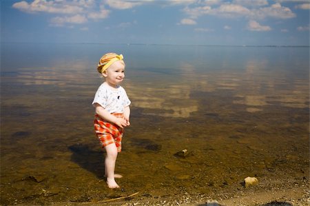 simsearch:400-04596901,k - small girl over the blue sky near the dirty river Stock Photo - Budget Royalty-Free & Subscription, Code: 400-04596899