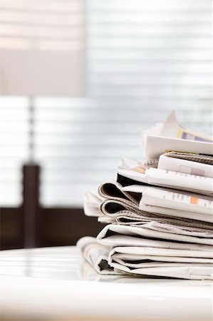 sunday market - pile of newspapers on the table Stock Photo - Budget Royalty-Free & Subscription, Code: 400-04597425