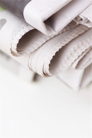 simsearch:400-04682528,k - pile of newspapers on white table Stock Photo - Budget Royalty-Free & Subscription, Code: 400-04597428