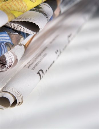 sunday market - pile of newspapers on white table Stock Photo - Budget Royalty-Free & Subscription, Code: 400-04597421