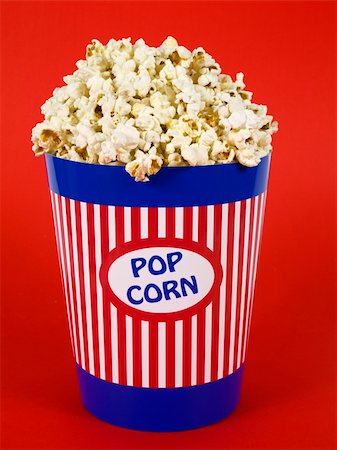 sweet and salty - A popcorn bucket over a red background. Stock Photo - Budget Royalty-Free & Subscription, Code: 400-04598507