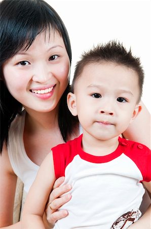 simsearch:400-04633809,k - Happy smiling young mother and her son. Photographie de stock - Aubaine LD & Abonnement, Code: 400-04598709