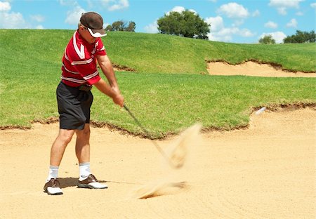 simsearch:400-05038623,k - Senior male golfer playing golf from the sand bunker on a beautiful summer day Stock Photo - Budget Royalty-Free & Subscription, Code: 400-04598788