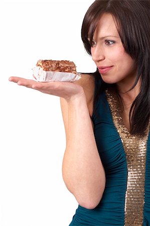 eyes birthday cake - Portrait of a beautiful young brunette woman tempted to eat a chocolate cake, isolated on white background Stock Photo - Budget Royalty-Free & Subscription, Code: 400-04598797