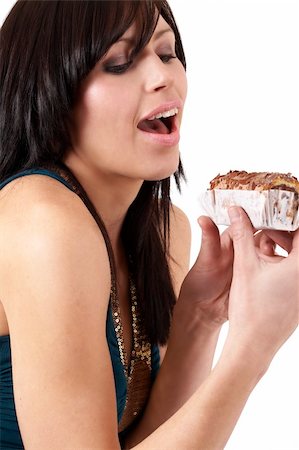 eyes birthday cake - Portrait of a beautiful young brunette woman tempted to eat a chocolate cake Stock Photo - Budget Royalty-Free & Subscription, Code: 400-04598801