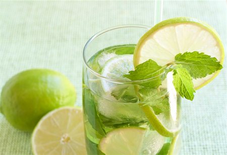 simsearch:400-07715048,k - Mojito cocktail with lime, mint leaves and ice on green background Stock Photo - Budget Royalty-Free & Subscription, Code: 400-04598854