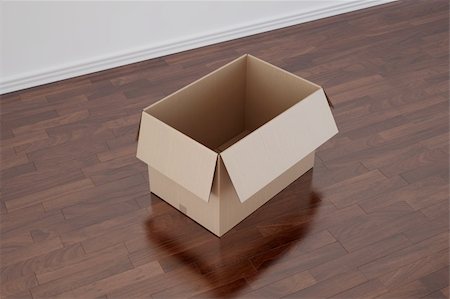 3d rendering of a cardboard box in a empty room with dark wood floor Stock Photo - Budget Royalty-Free & Subscription, Code: 400-04598911