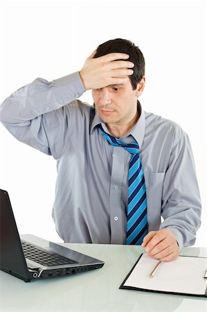 panic - Shocked businessman looking at laptop and holding his head - isolated Stock Photo - Budget Royalty-Free & Subscription, Code: 400-04599012
