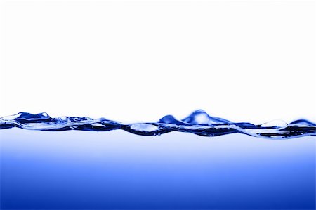 simsearch:659-03524635,k - Crisp, clear, blue water photographed against white. Stockbilder - Microstock & Abonnement, Bildnummer: 400-04599027