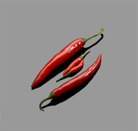 simsearch:400-05732421,k - fresh red chili peppers over grey reflective surface Photographie de stock - Aubaine LD & Abonnement, Code: 400-04599037