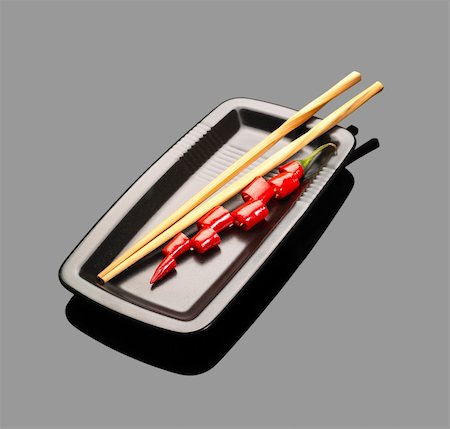 simsearch:400-04697254,k - fresh red chili peppers on a plate with chopstikcs over grey reflective surface Foto de stock - Super Valor sin royalties y Suscripción, Código: 400-04599039