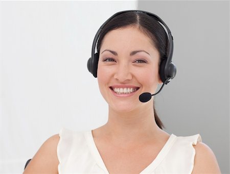 simsearch:400-03985399,k - International Business woman on a Headset smiling Photographie de stock - Aubaine LD & Abonnement, Code: 400-04599214