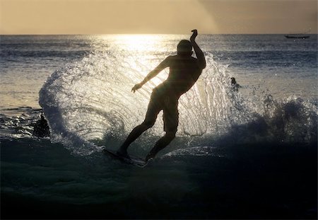 simsearch:400-07212763,k - Young men - the surfer in ocean. Bali. Indonesia Photographie de stock - Aubaine LD & Abonnement, Code: 400-04599286