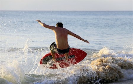 simsearch:400-04476949,k - Young men - the surfer in ocean. Bali. Indonesia Photographie de stock - Aubaine LD & Abonnement, Code: 400-04599288