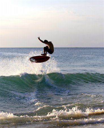 surfing extreme sport - Young men - the surfer in ocean. Dreamland beach - Bali. Indonesia. Foto de stock - Super Valor sin royalties y Suscripción, Código: 400-04599289