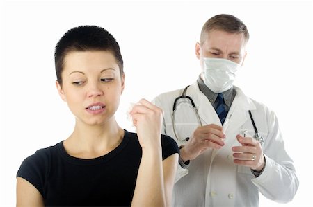Woman indefinitely looks away from a doctor with a syringe. Stock Photo - Budget Royalty-Free & Subscription, Code: 400-04599817