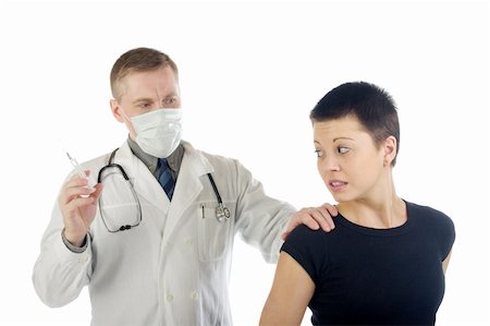 Doctor in gauze mask holds a frightened woman by her shoulder and prepares a syringe for an injection Stock Photo - Budget Royalty-Free & Subscription, Code: 400-04599820