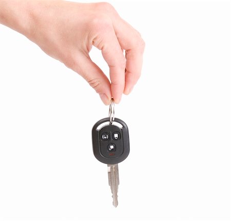 holding automobile keys isolated on white background Stock Photo - Budget Royalty-Free & Subscription, Code: 400-04590086