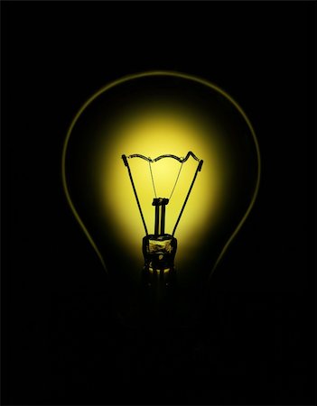 Bulb backlit with yellow light on black background. Stock Photo - Budget Royalty-Free & Subscription, Code: 400-04590248