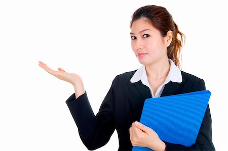 simsearch:400-06142860,k - Portrait of a beautiful young businesswoman, holding out her hand as displaying something. Ready for you to add text. Fotografie stock - Microstock e Abbonamento, Codice: 400-04590327