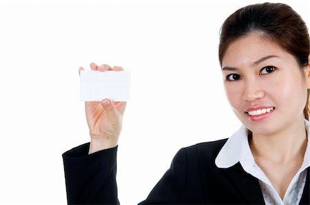 simsearch:400-06142860,k - Portrait of a beautiful Asian business woman holding a blank notecard. Fotografie stock - Microstock e Abbonamento, Codice: 400-04590328