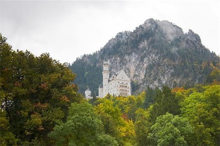 White Neuschwanstein castle in beautiful mountain setting Stock Photo - Budget Royalty-Free & Subscription, Code: 400-04590331