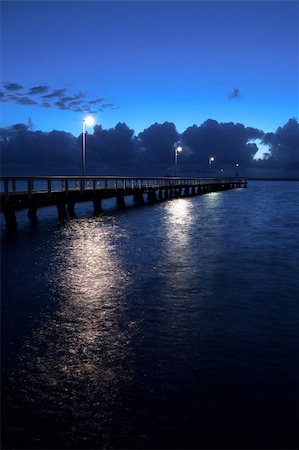 darvidanoar (artist) - Jetty at night with lights on the water Fotografie stock - Microstock e Abbonamento, Codice: 400-04590356