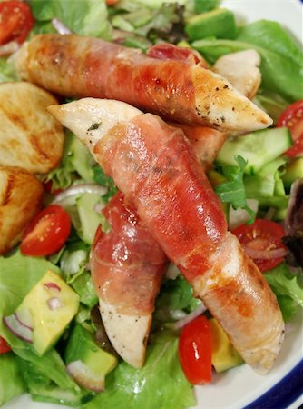 simsearch:400-04626174,k - Chicken tenderloins wrapped in prosciutto with oven roasted chat potatoes and a garden salad. Photographie de stock - Aubaine LD & Abonnement, Code: 400-04590684