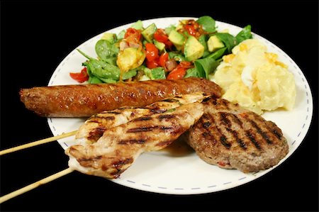 BBQ chicken tenderloin skewers, beef sausage, beef patty with spinach salad and potato salad. Stock Photo - Budget Royalty-Free & Subscription, Code: 400-04590682