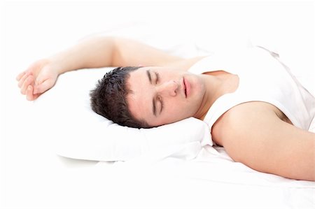 Man sleeping on white bed Stock Photo - Budget Royalty-Free & Subscription, Code: 400-04590742