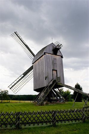 simsearch:400-07569215,k - Old wooden wind mill against sky with white clouds Stock Photo - Budget Royalty-Free & Subscription, Code: 400-04590801