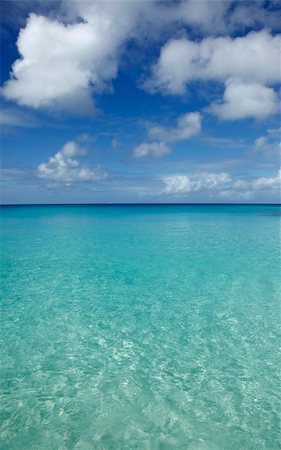 Anguilla, West Indies: This tiny half moon shaped bay with powder sand beach and clear water is protected by high cliffs so the ambience is tranquil and excellent for sunbathing and snorkelling. Access is by boat only from Crocus Bay. Nearby Shoal Bay - which some consider to be Anguilla's best beach, Rendezvous Bay, or Road Bay offer a few more facilities and action.    St Maarten/St Martin´s Bea Photographie de stock - Aubaine LD & Abonnement, Code: 400-04590817