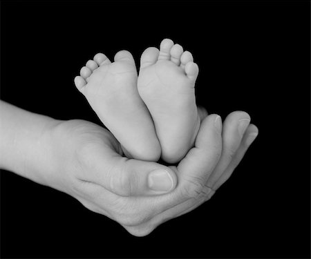 A Newborn's Feet Cradled in Her Parent's Hand Stock Photo - Budget Royalty-Free & Subscription, Code: 400-04591303