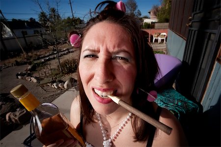 Hispanic woman in front of house with messy yard Stock Photo - Budget Royalty-Free & Subscription, Code: 400-04591314