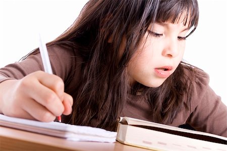 simsearch:400-04131892,k - Young Girl doing homework - Isolated on white Stockbilder - Microstock & Abonnement, Bildnummer: 400-04591688