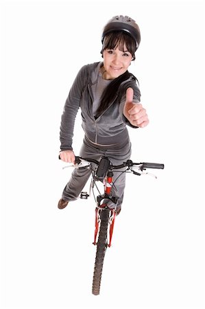 riding a bike funny pic - attractive brunette woman with bike. over white background Stock Photo - Budget Royalty-Free & Subscription, Code: 400-04591723