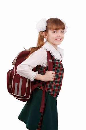 Young school girl ready for school. Little pupil is going to school. Happy young schoolgirl with satchel white background. Portrait of smiling, little girl in school uniform with backpack.  Education, learning, teaching. Stock Photo - Budget Royalty-Free & Subscription, Code: 400-04592440