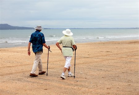 Senior couple on the beach at sunset Stock Photo - Budget Royalty-Free & Subscription, Code: 400-04592441