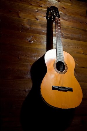 shadow acoustic guitar - old guitar on the wall Stock Photo - Budget Royalty-Free & Subscription, Code: 400-04592614