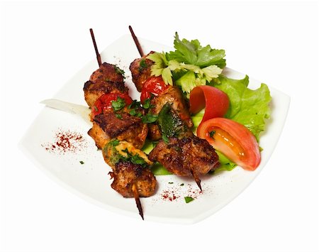 grilled meat pieces on wood sticks with vegetables Stock Photo - Budget Royalty-Free & Subscription, Code: 400-04592612
