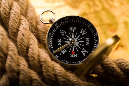 simsearch:400-07676872,k - Close up view of the compass on old map. Photographie de stock - Aubaine LD & Abonnement, Code: 400-04592711