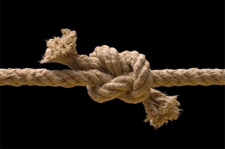 simsearch:400-04060285,k - Tied knot on rope hanging horizontal isolated over black background Fotografie stock - Microstock e Abbonamento, Codice: 400-04592911