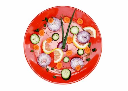 red plate with cut vegetables isolated over white Stock Photo - Budget Royalty-Free & Subscription, Code: 400-04593255