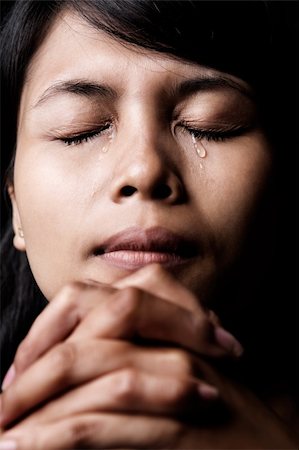 sad and quiet woman - Asian woman is praying and shed tear. Stock Photo - Budget Royalty-Free & Subscription, Code: 400-04604124