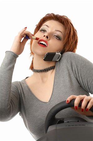 simulator - Scene - the woman doing a make-up during driving on the car, isolated Stock Photo - Budget Royalty-Free & Subscription, Code: 400-04604297