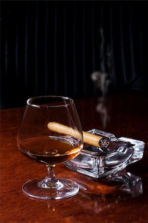 Snifter glass of cognac and cigar Stock Photo - Budget Royalty-Free & Subscription, Code: 400-04604315