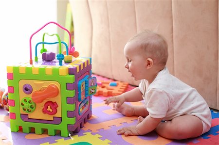 Portrait of cute newborn playing with toys Stock Photo - Budget Royalty-Free & Subscription, Code: 400-04604376